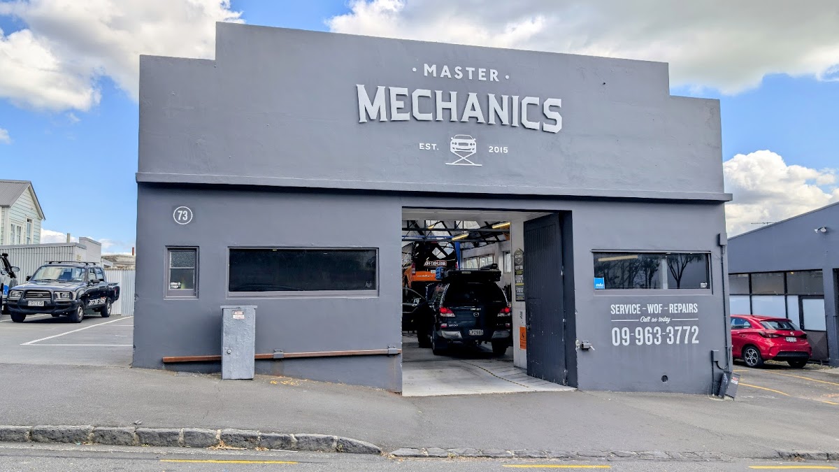 Master Mechanics workshop at 73 Upper Queen Street, Eden Terrace — grey building with signage reading Service, WOF, Repairs