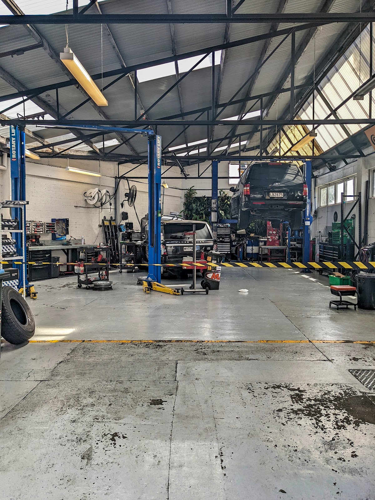 Inside the Master Mechanics workshop — vehicle hoists and professional equipment